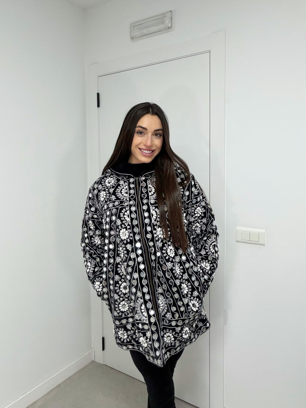 Abrigo detalles joyas