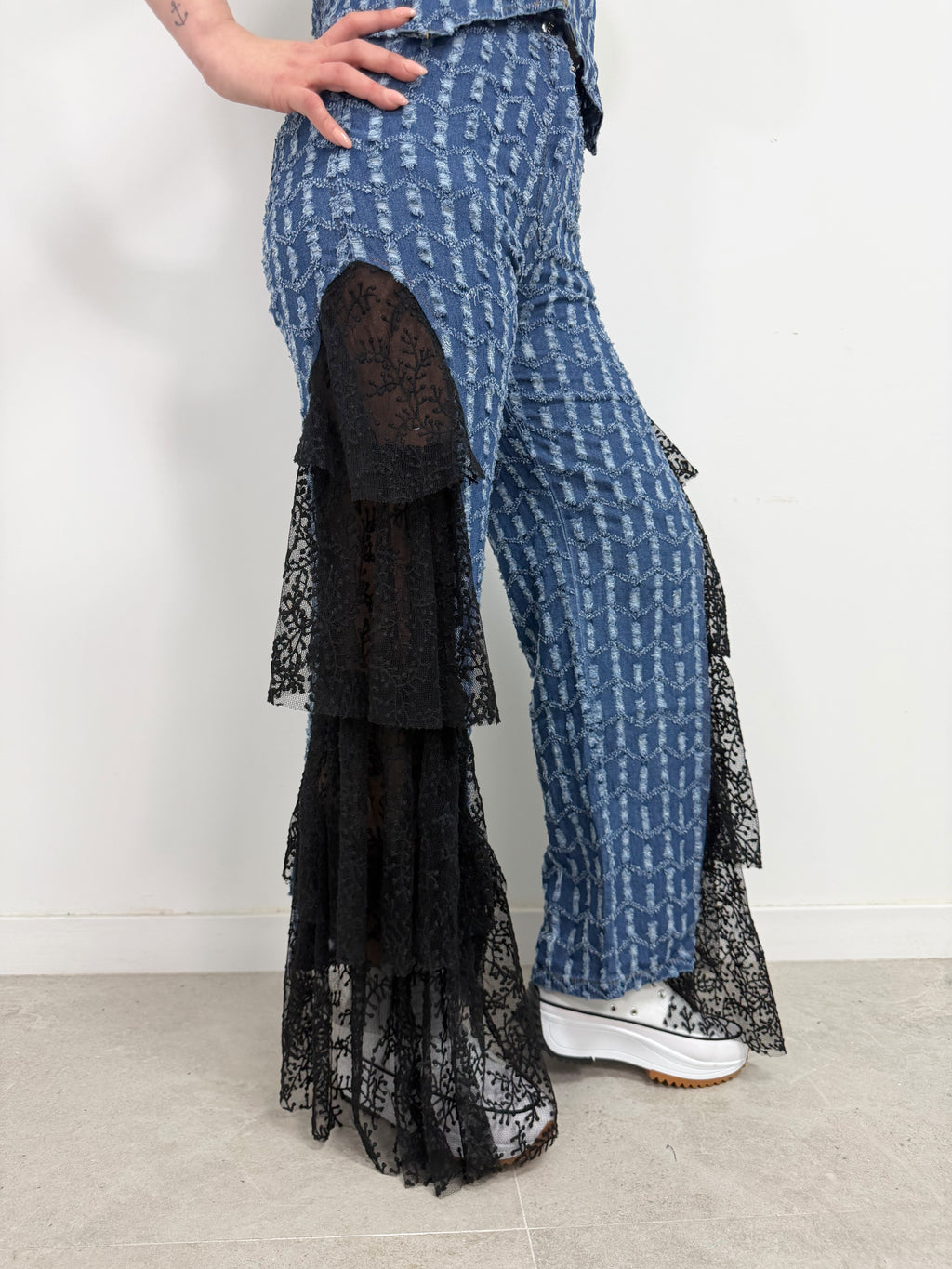 Top denim volante